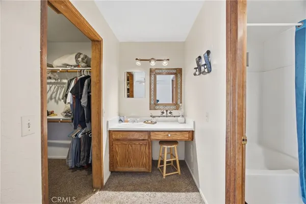 a view of a kitchen from a hallway