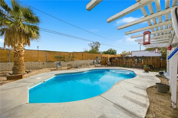 a view of a swimming pool with a lounge chair