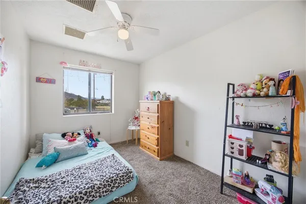 a bedroom with a bed and cabinets