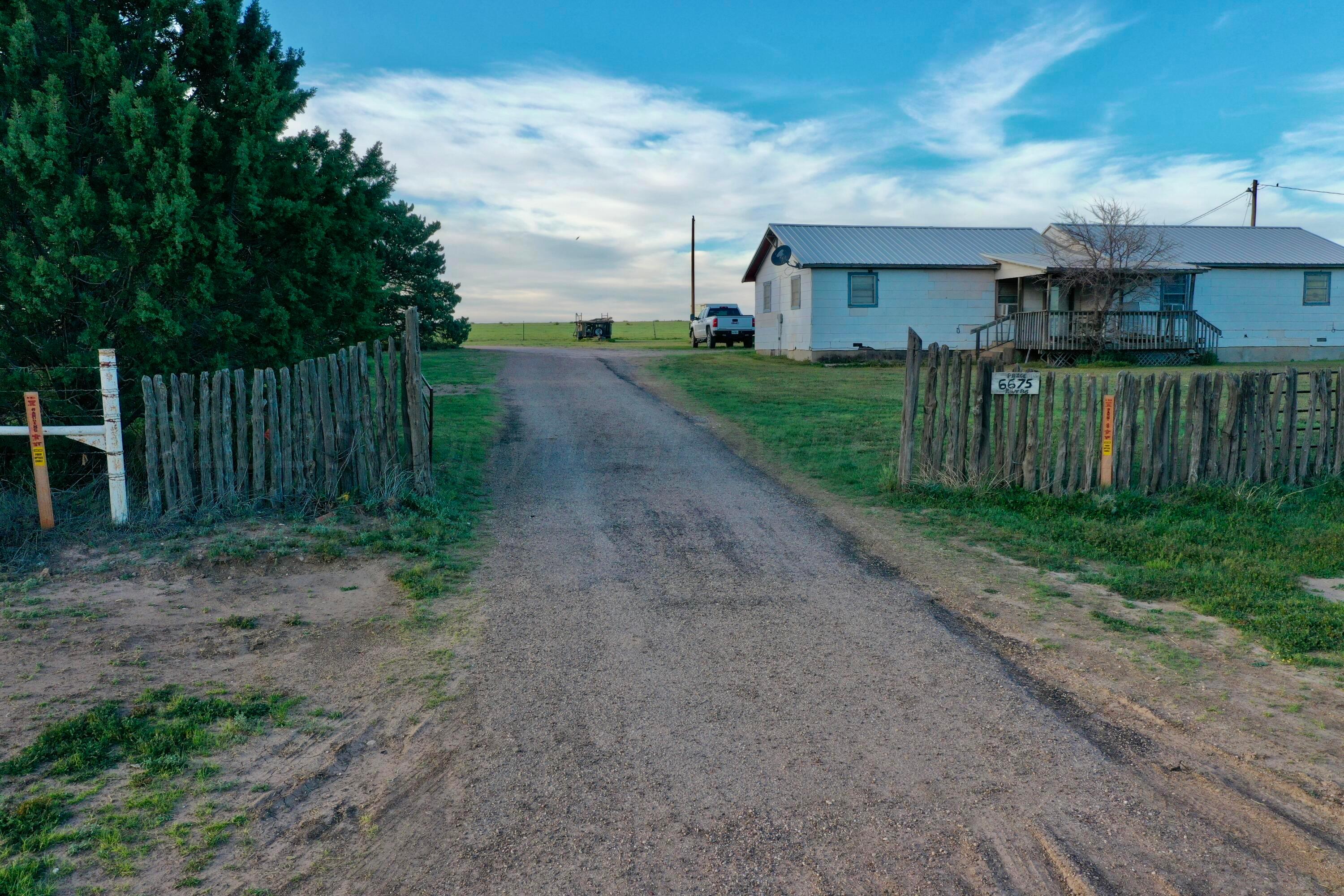 6675 Highway 86 Tulia, TX 79088 - Photo 28 of 68 a view of a house with backyard and a tree