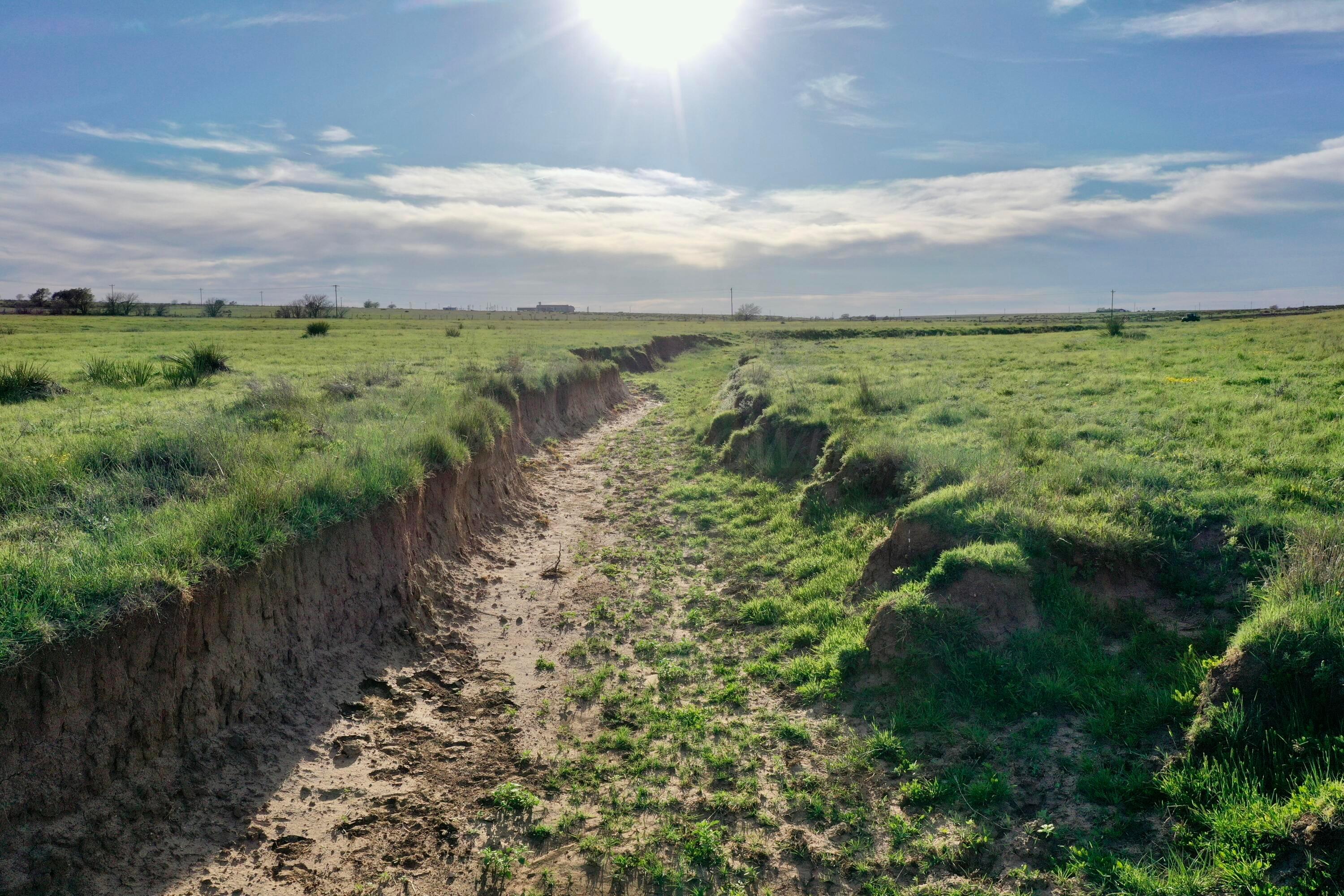 6675 Highway 86 Tulia, TX 79088 - Photo 6 of 68 a view of a lake with a yard