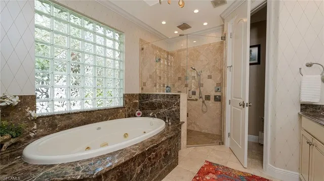 a bathroom with a tub and shower