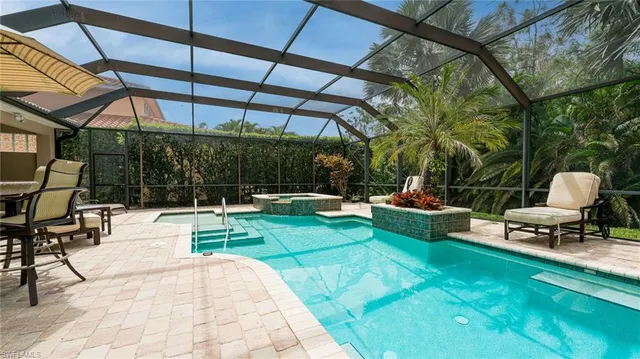 a view of a swimming pool with a patio