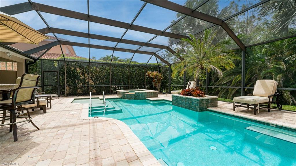 7667 Martino Circle Naples, FL 34112 - Photo 28 of 41 a view of a swimming pool with a patio