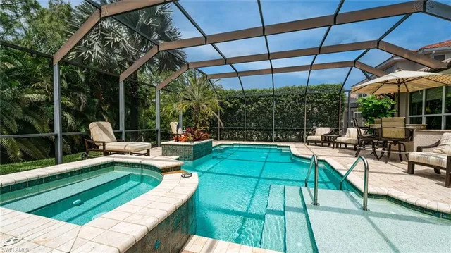 a view of a swimming pool with a patio