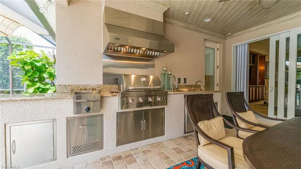 a kitchen with stainless steel appliances granite countertop a stove and a refrigerator