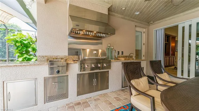 a kitchen with stainless steel appliances granite countertop a stove and a refrigerator