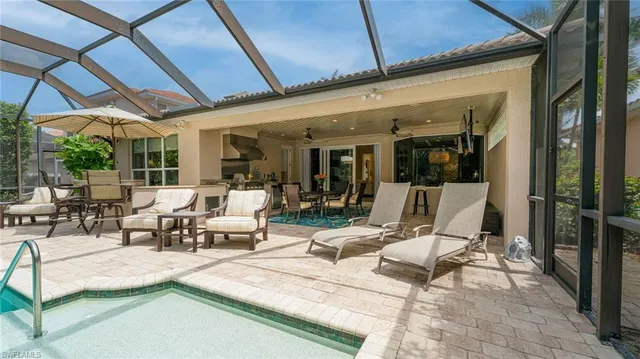 a view of a patio with table and chairs and potted plants