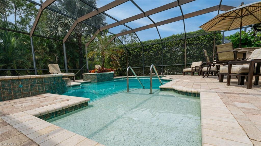 7667 Martino Circle Naples, FL 34112 - Photo 32 of 41 a view of a backyard with sitting area
