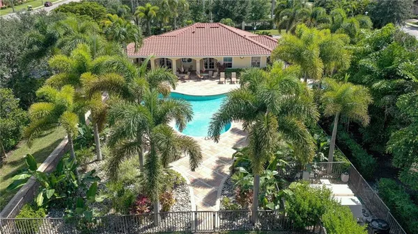 a view of a house with yard and sitting area