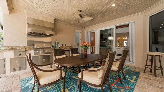 a dining room with furniture a rug and wooden floor