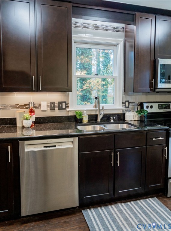 8603 Boones Bluff Mews, Unit MEWS Chesterfield, VA 23832 - Photo 17 of 46 a kitchen with a sink stove and cabinets