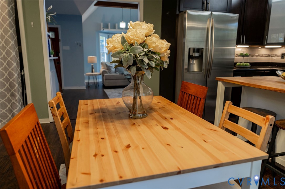 8603 Boones Bluff Mews, Unit MEWS Chesterfield, VA 23832 - Photo 19 of 46 a dining room with furniture and a potted plant