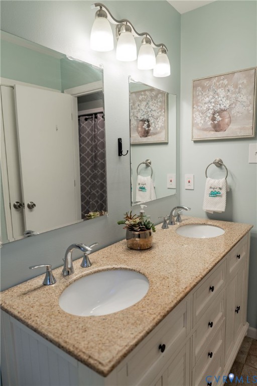 8603 Boones Bluff Mews, Unit MEWS Chesterfield, VA 23832 - Photo 21 of 46 a bathroom with a granite countertop sink and a mirror