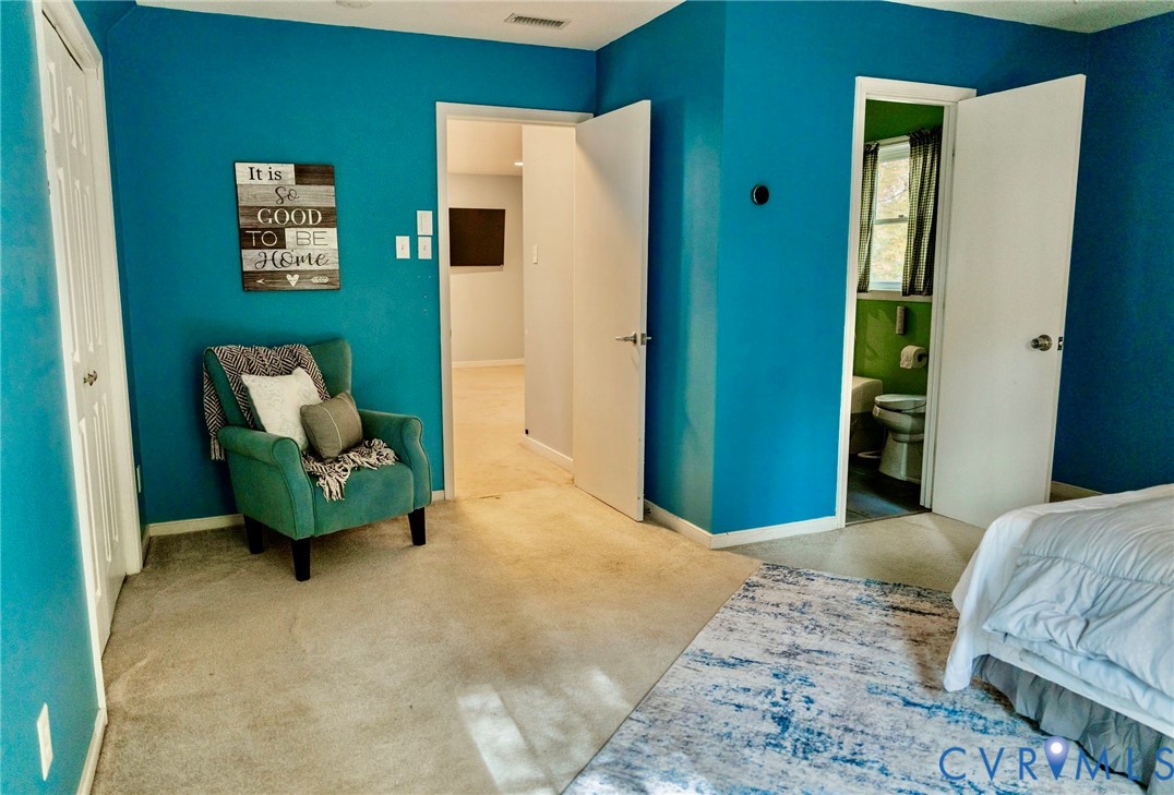 8603 Boones Bluff Mews, Unit MEWS Chesterfield, VA 23832 - Photo 22 of 46 a bedroom with a bed and a painting on the wall