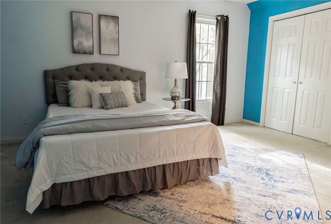 8603 Boones Bluff Mews, Unit MEWS Chesterfield, VA 23832 - Photo 23 of 46 a bedroom with a bed and window
