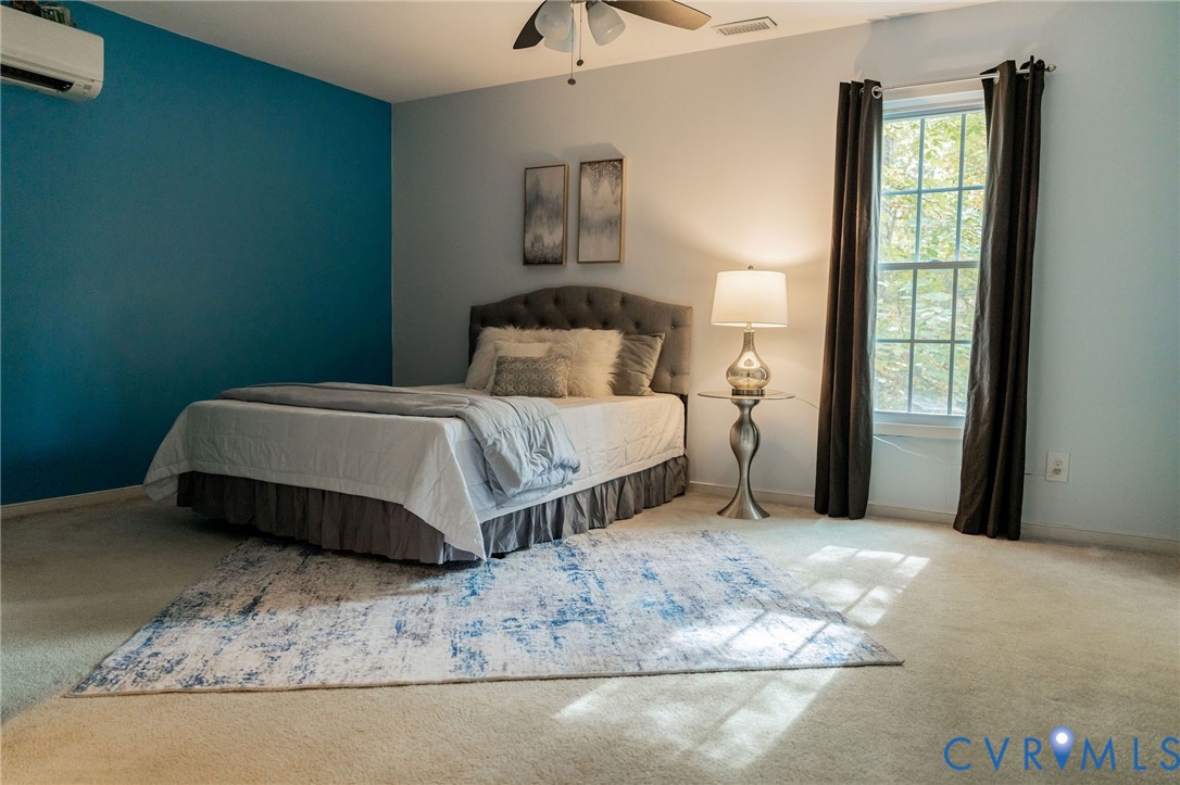 8603 Boones Bluff Mews, Unit MEWS Chesterfield, VA 23832 - Photo 24 of 46 a bedroom with a bed and a window