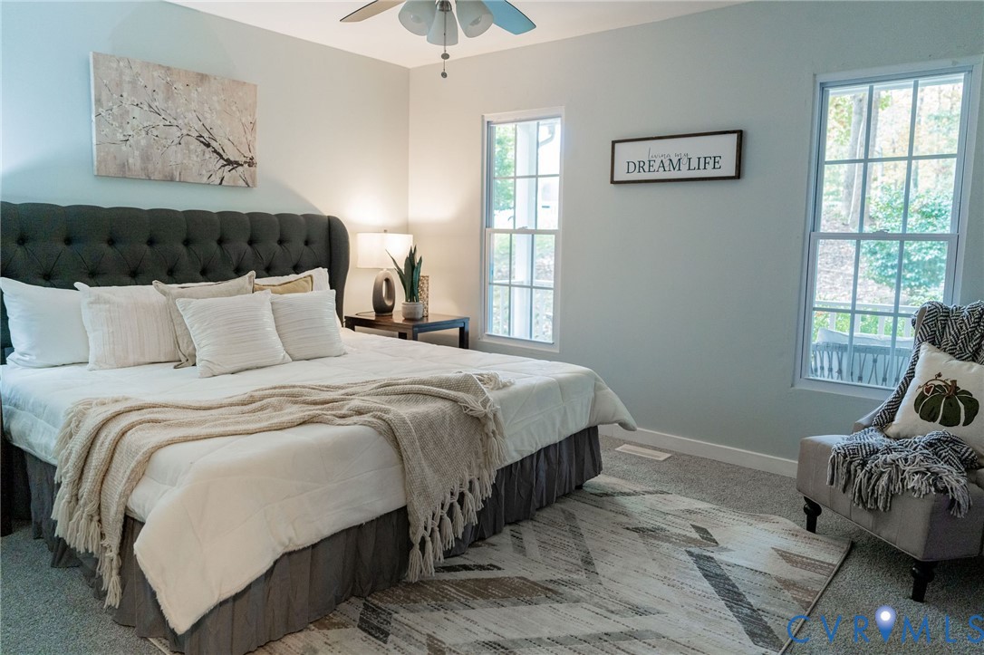 8603 Boones Bluff Mews, Unit MEWS Chesterfield, VA 23832 - Photo 25 of 46 a bedroom with bed and a window