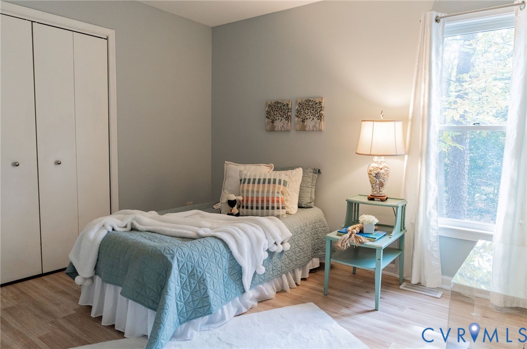 8603 Boones Bluff Mews, Unit MEWS Chesterfield, VA 23832 - Photo 29 of 46 a bedroom with a bed and a window