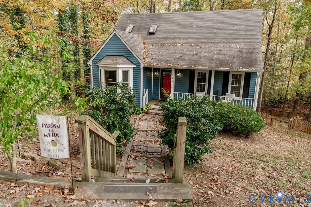 8603 Boones Bluff Mews, Unit MEWS Chesterfield, VA 23832 - Photo 38 of 46 front view of a house with a garden