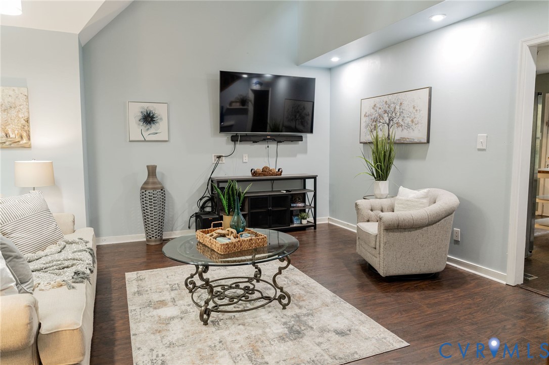 8603 Boones Bluff Mews, Unit MEWS Chesterfield, VA 23832 - Photo 41 of 46 a living room with furniture a flat screen tv and a fireplace