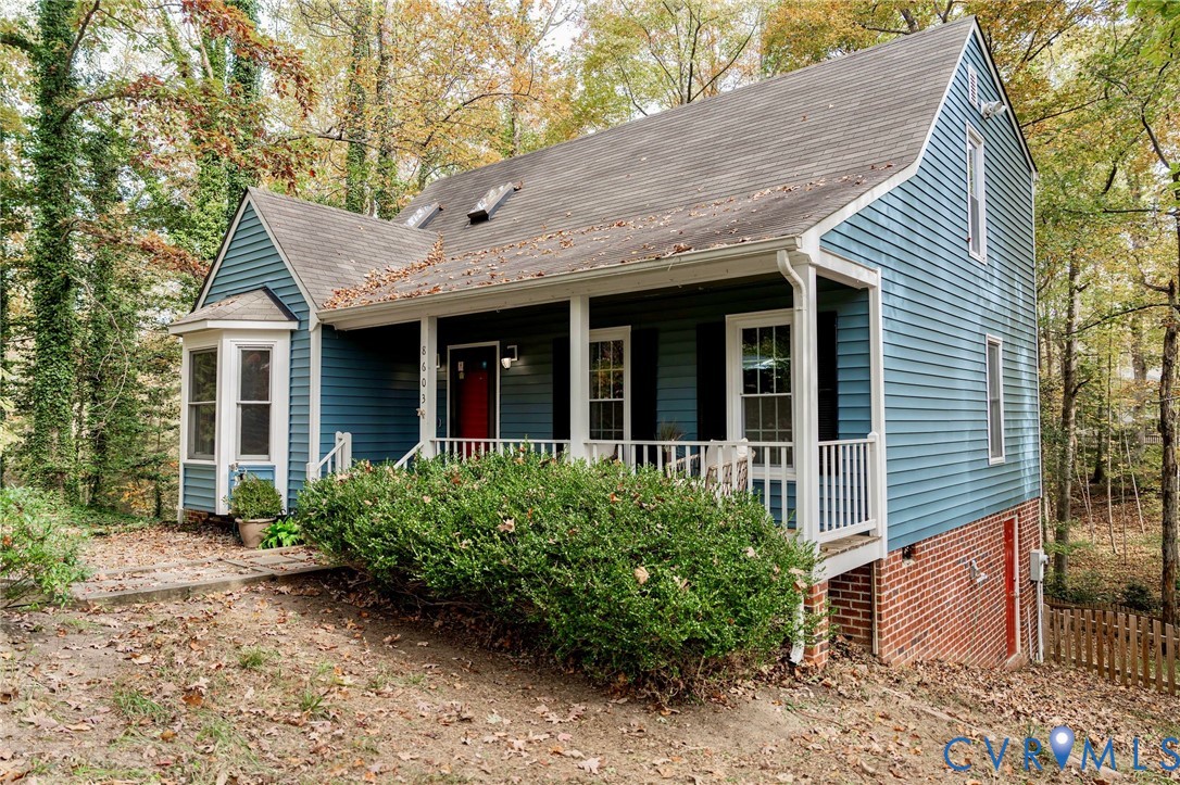 8603 Boones Bluff Mews, Unit MEWS Chesterfield, VA 23832 - Photo 8 of 46 a view of brick house with plants and a table and chairs