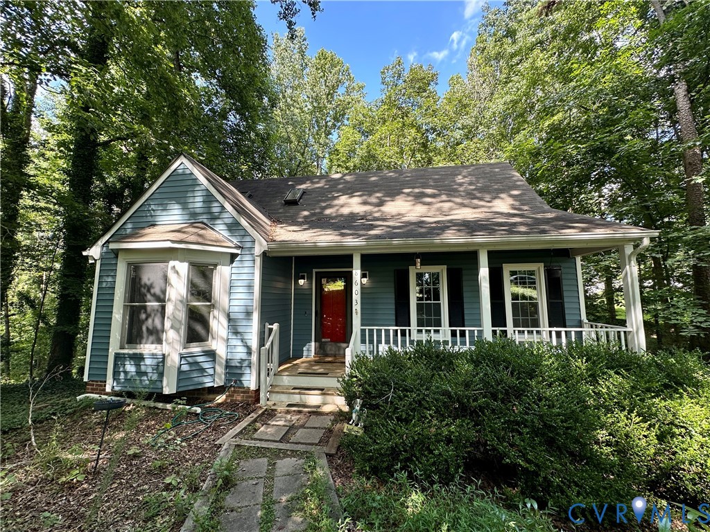 8603 Boones Bluff Mews, Unit MEWS Chesterfield, VA 23832 - Photo 9 of 46 a front view of a house with a yard