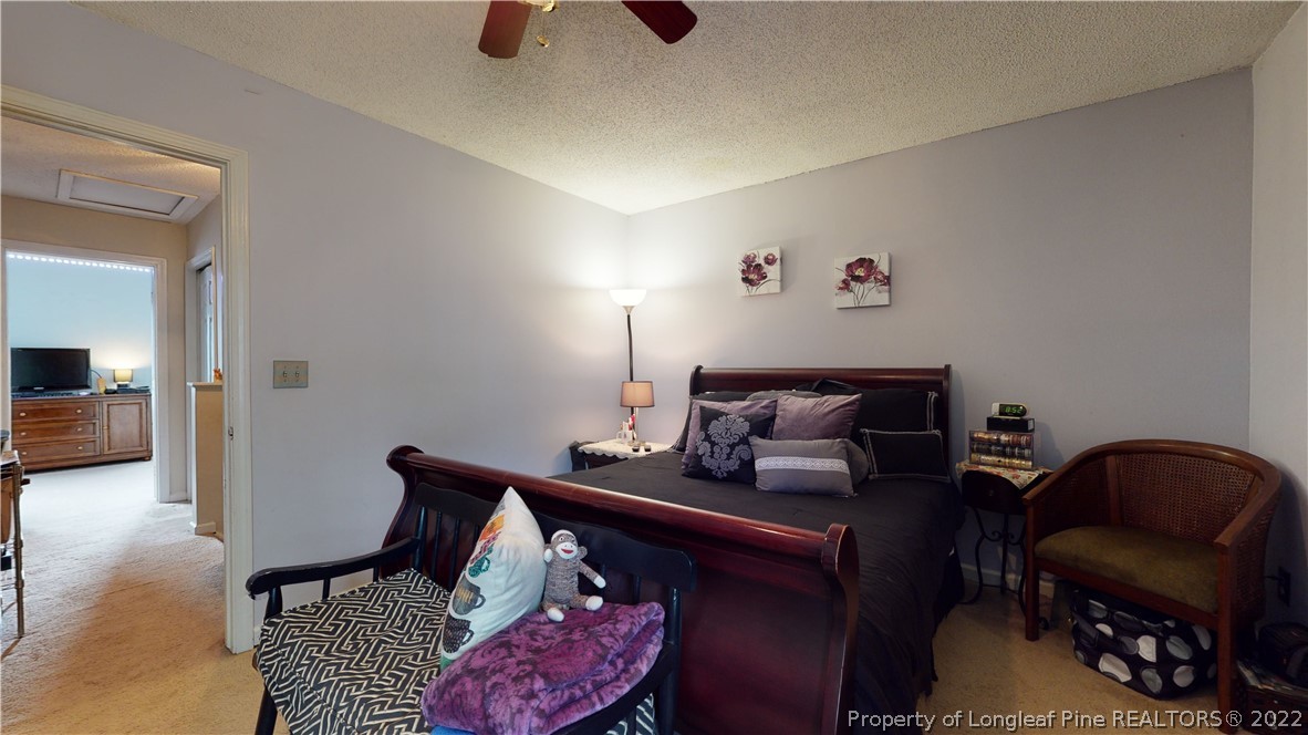 4604 Pine Trace Drive Raleigh, NC 27613 - Photo 15 of 30 a bed room with furniture and a chair