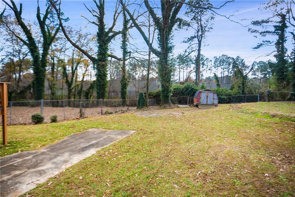 142 Hutton Place Northwest Atlanta, GA 30318 - Photo 14 of 14 a view of a playground with basketball court
