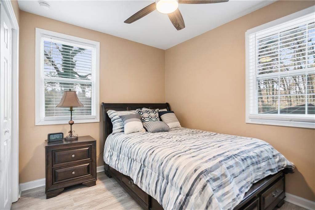 142 Hutton Place Northwest Atlanta, GA 30318 - Photo 8 of 14 a bedroom with a bed and a window