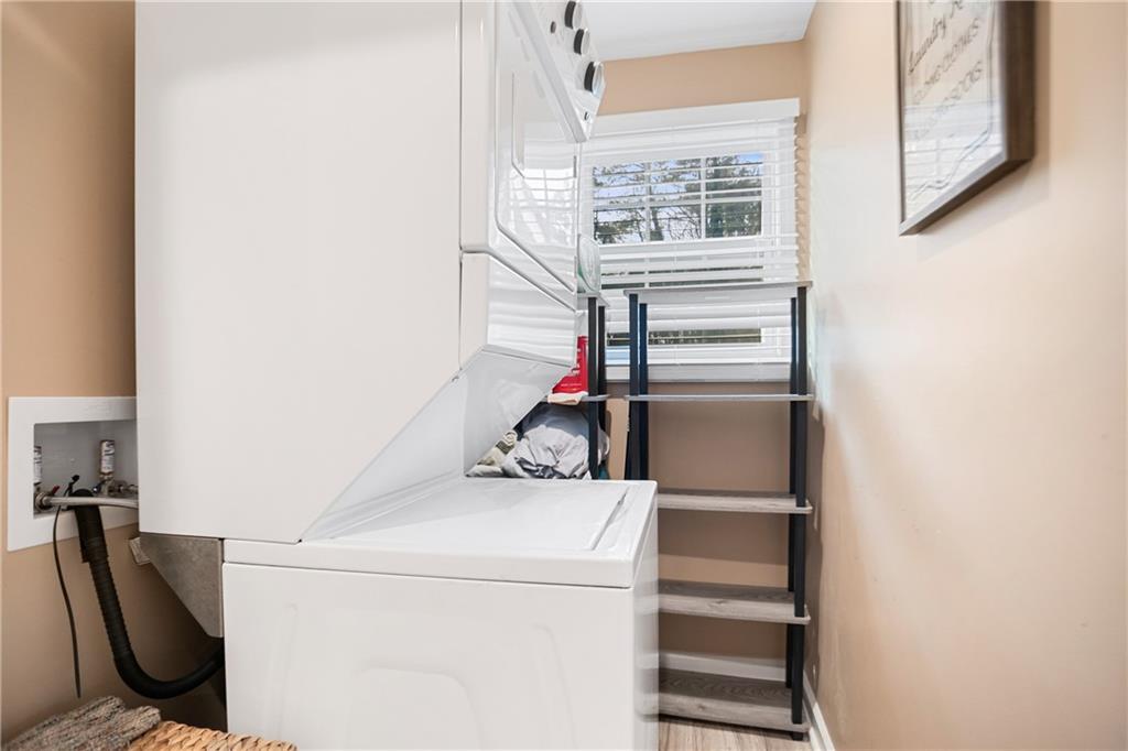 142 Hutton Place Northwest Atlanta, GA 30318 - Photo 10 of 14 a utility room with dryer and washer