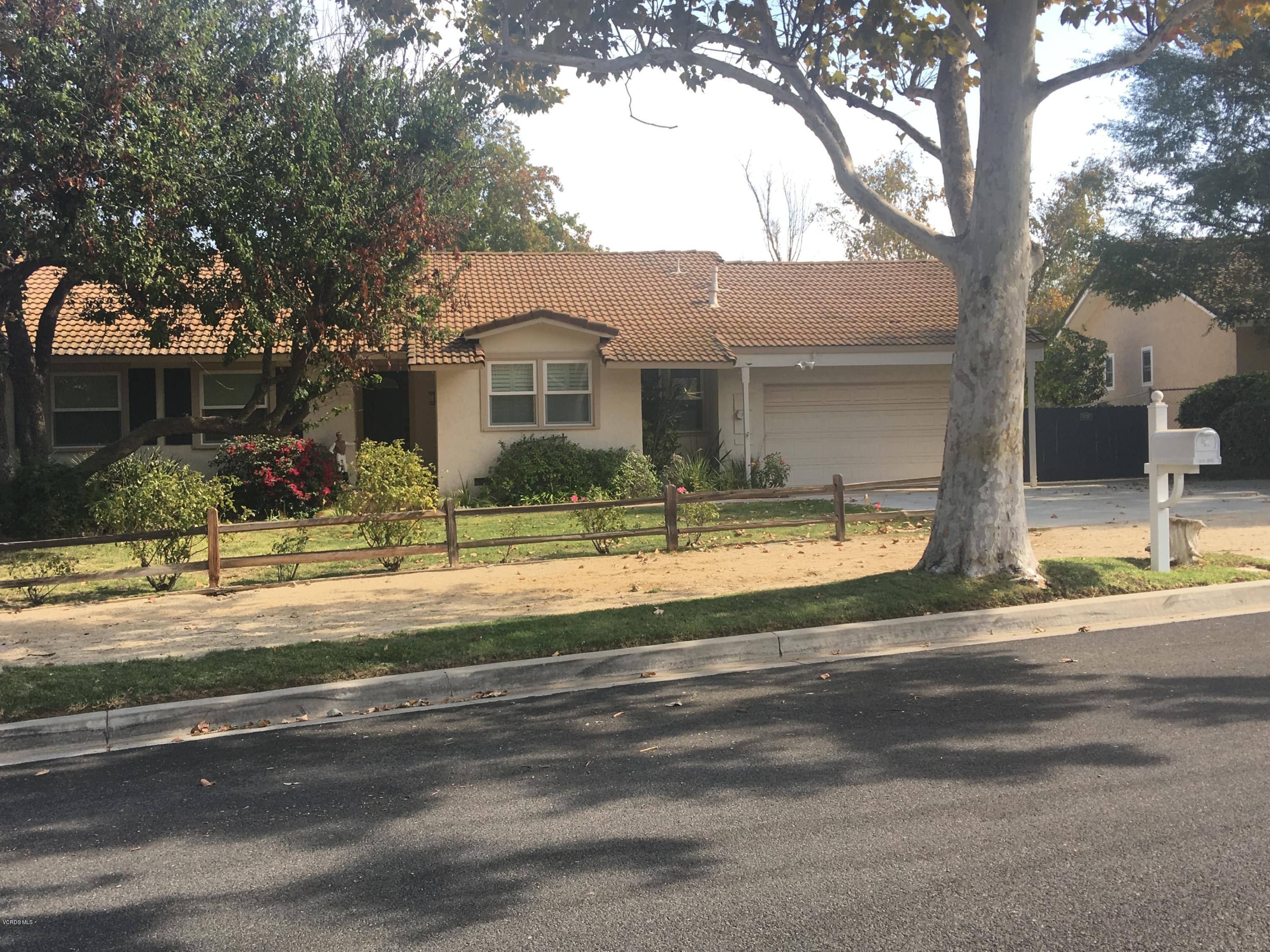 718 Tranquil Lane Simi Valley, CA 93065 - Photo 2 of 68 front view of a house with a street