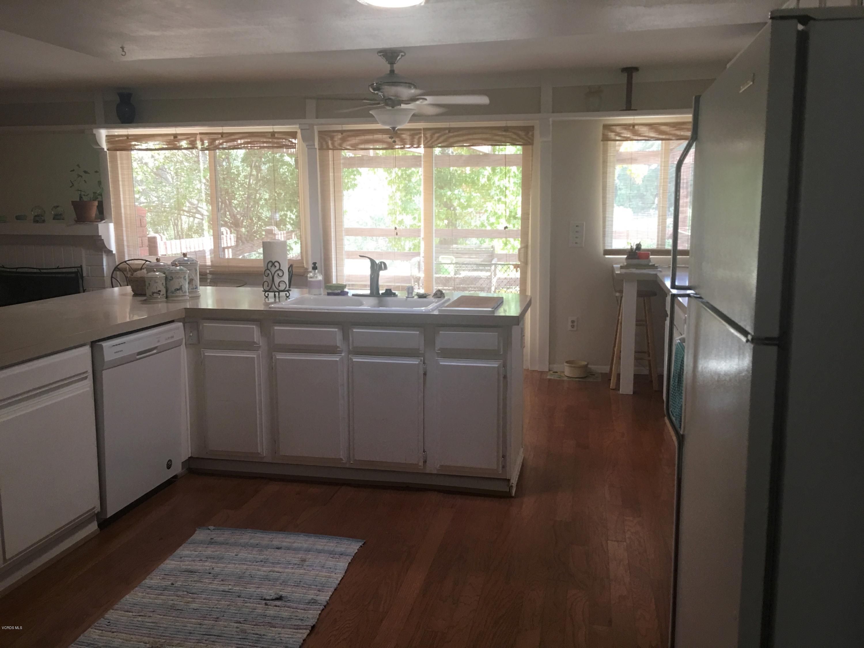 718 Tranquil Lane Simi Valley, CA 93065 - Photo 15 of 68 a kitchen with sink and window