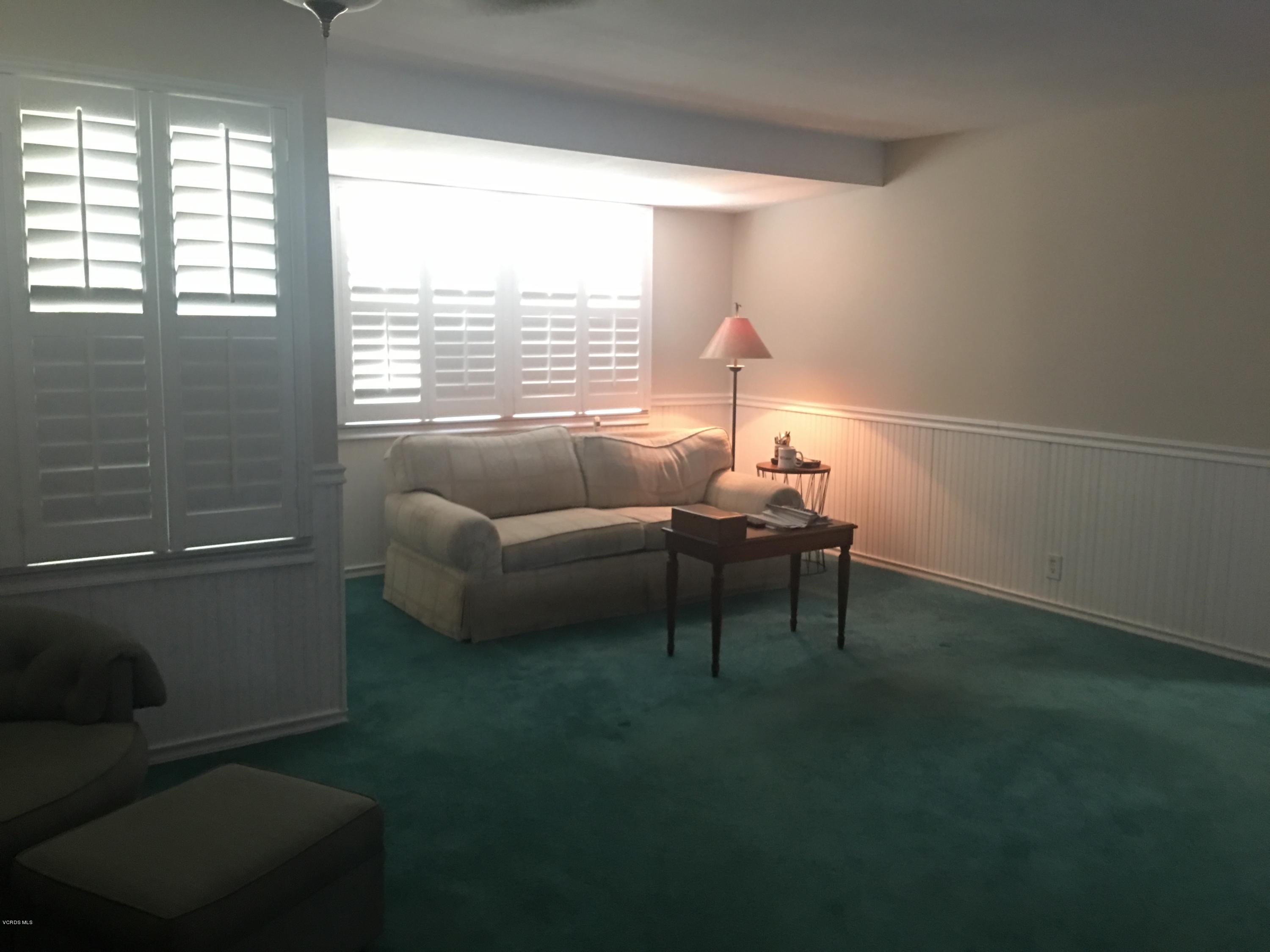 718 Tranquil Lane Simi Valley, CA 93065 - Photo 3 of 68 a living room with furniture and a lamp