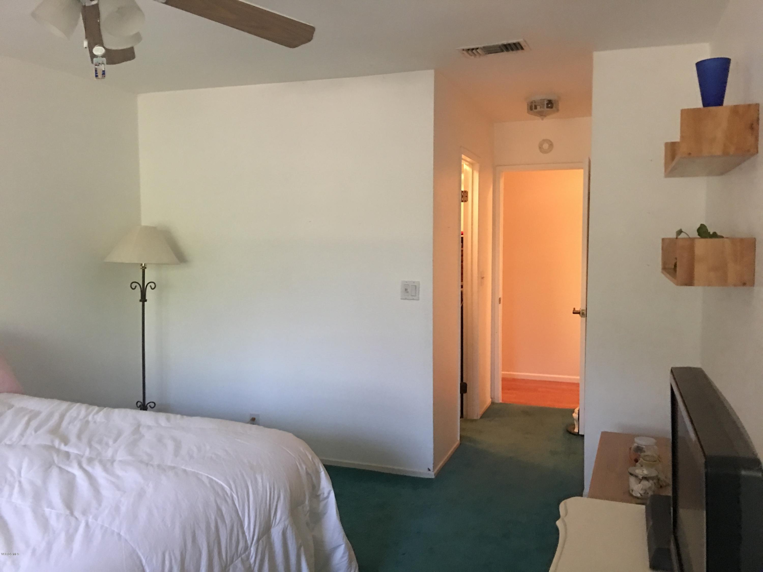 718 Tranquil Lane Simi Valley, CA 93065 - Photo 24 of 68 a bedroom with a bed and a hallway