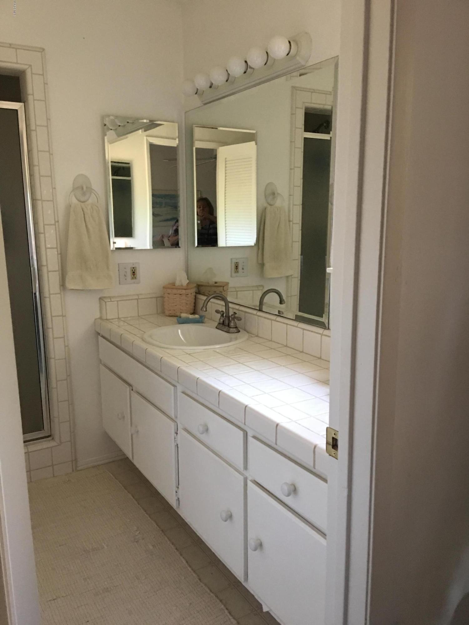 718 Tranquil Lane Simi Valley, CA 93065 - Photo 25 of 68 a bathroom with a double vanity sink and mirror
