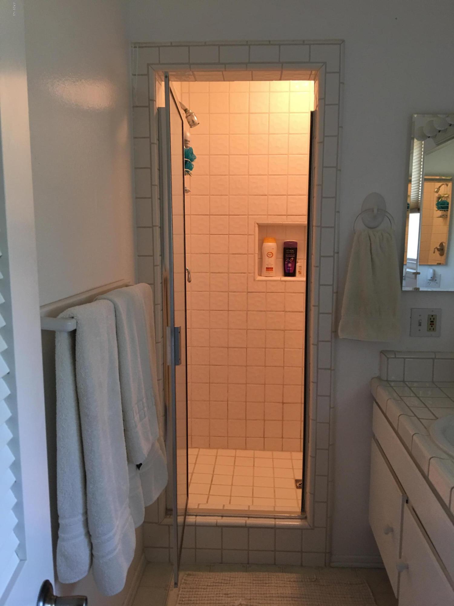 718 Tranquil Lane Simi Valley, CA 93065 - Photo 27 of 68 a bathroom with a shower