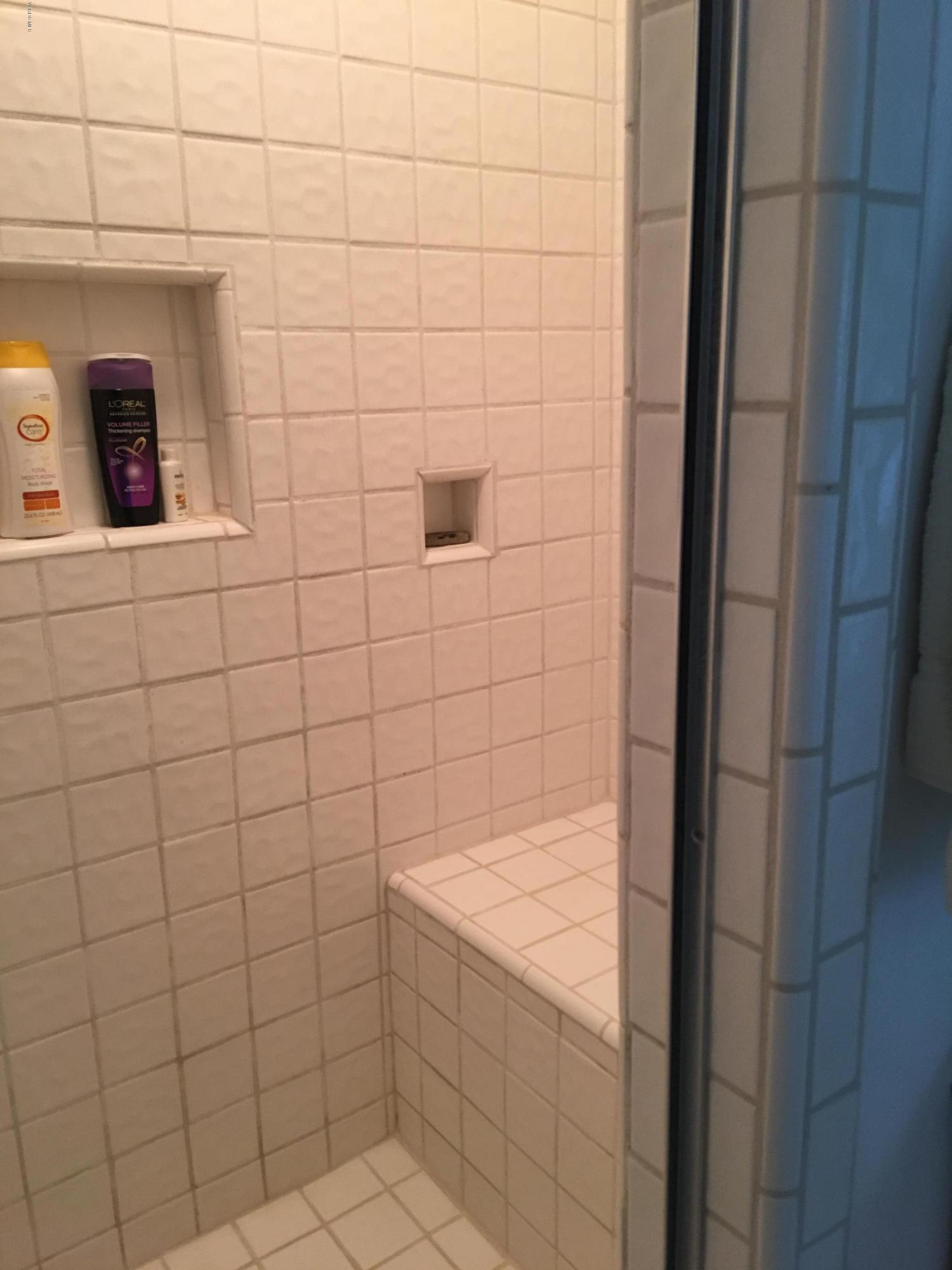 718 Tranquil Lane Simi Valley, CA 93065 - Photo 28 of 68 a bathroom with a shower and sink