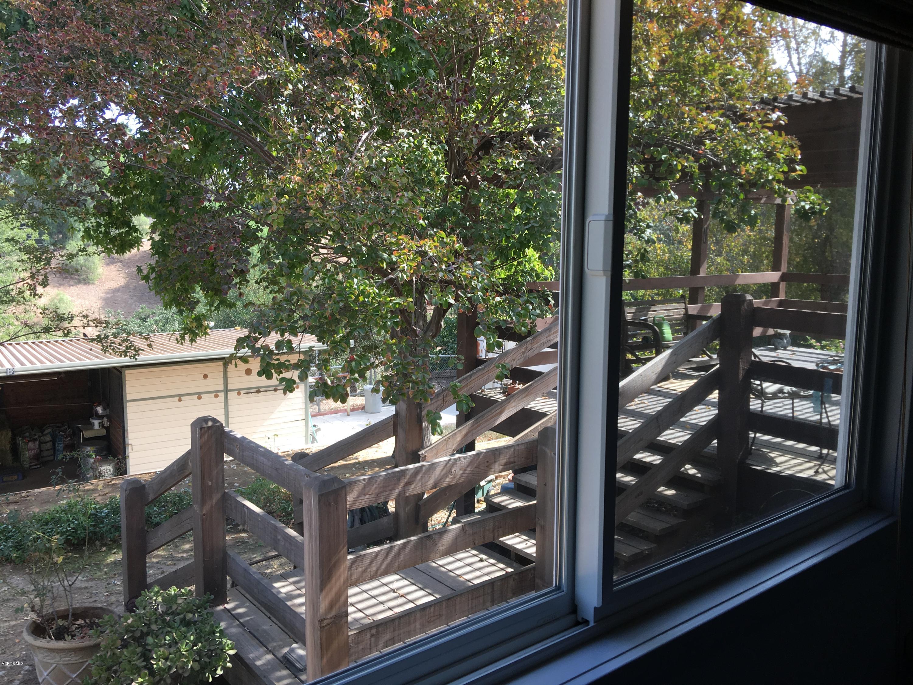 718 Tranquil Lane Simi Valley, CA 93065 - Photo 30 of 68 a view of a balcony with a tree