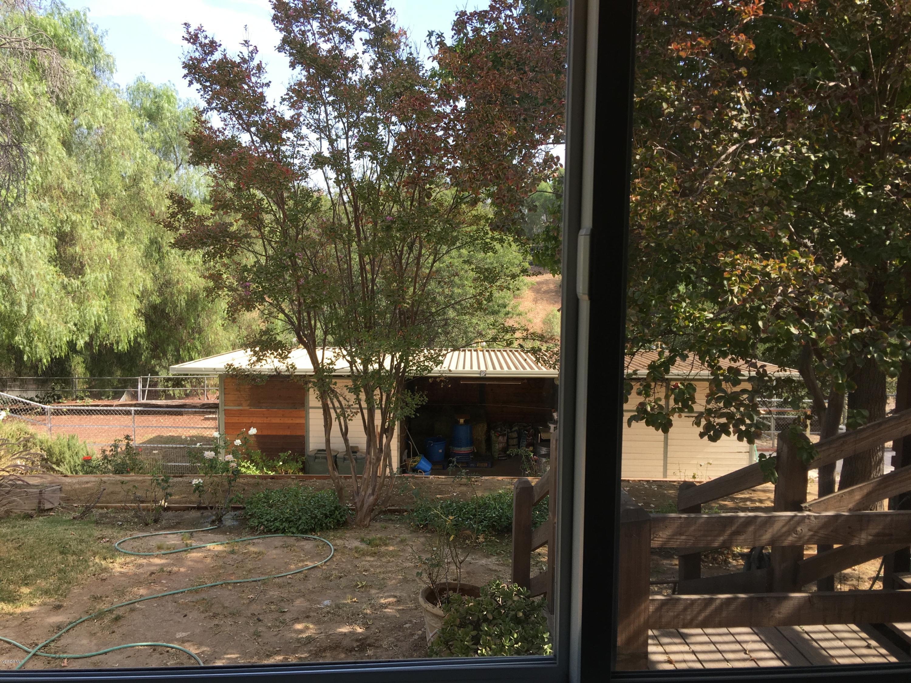 718 Tranquil Lane Simi Valley, CA 93065 - Photo 31 of 68 a view of a yard in front of a house with large tree