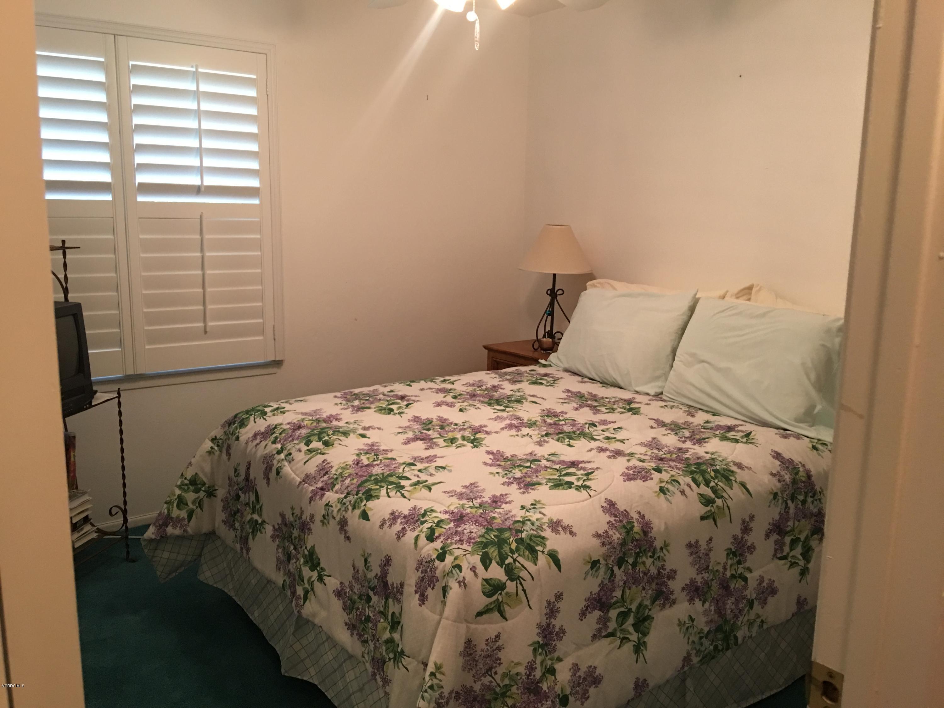 718 Tranquil Lane Simi Valley, CA 93065 - Photo 33 of 68 a bed sitting in a bedroom next to a window