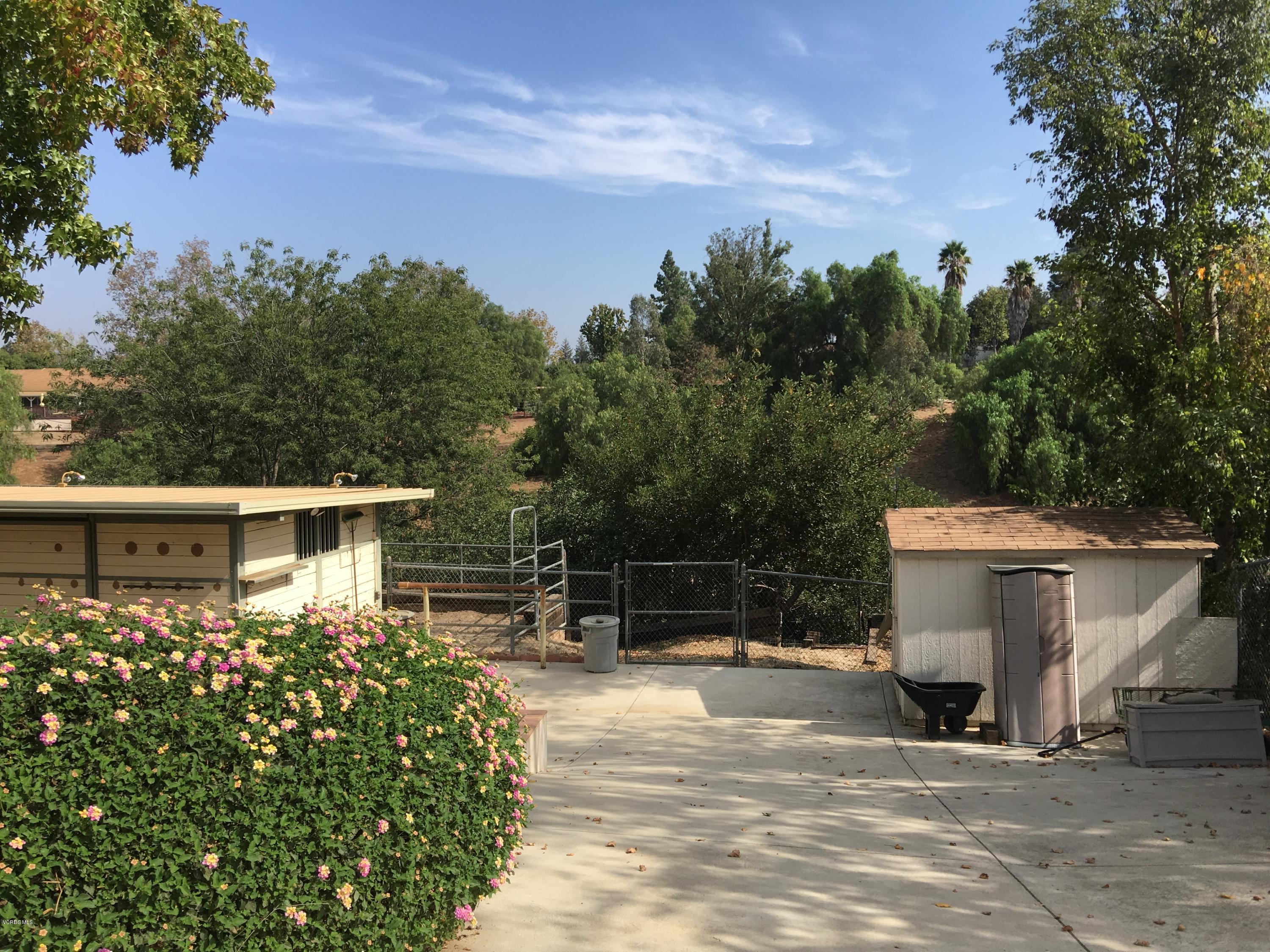 718 Tranquil Lane Simi Valley, CA 93065 - Photo 39 of 68 a view of a white house with a yard and sitting area