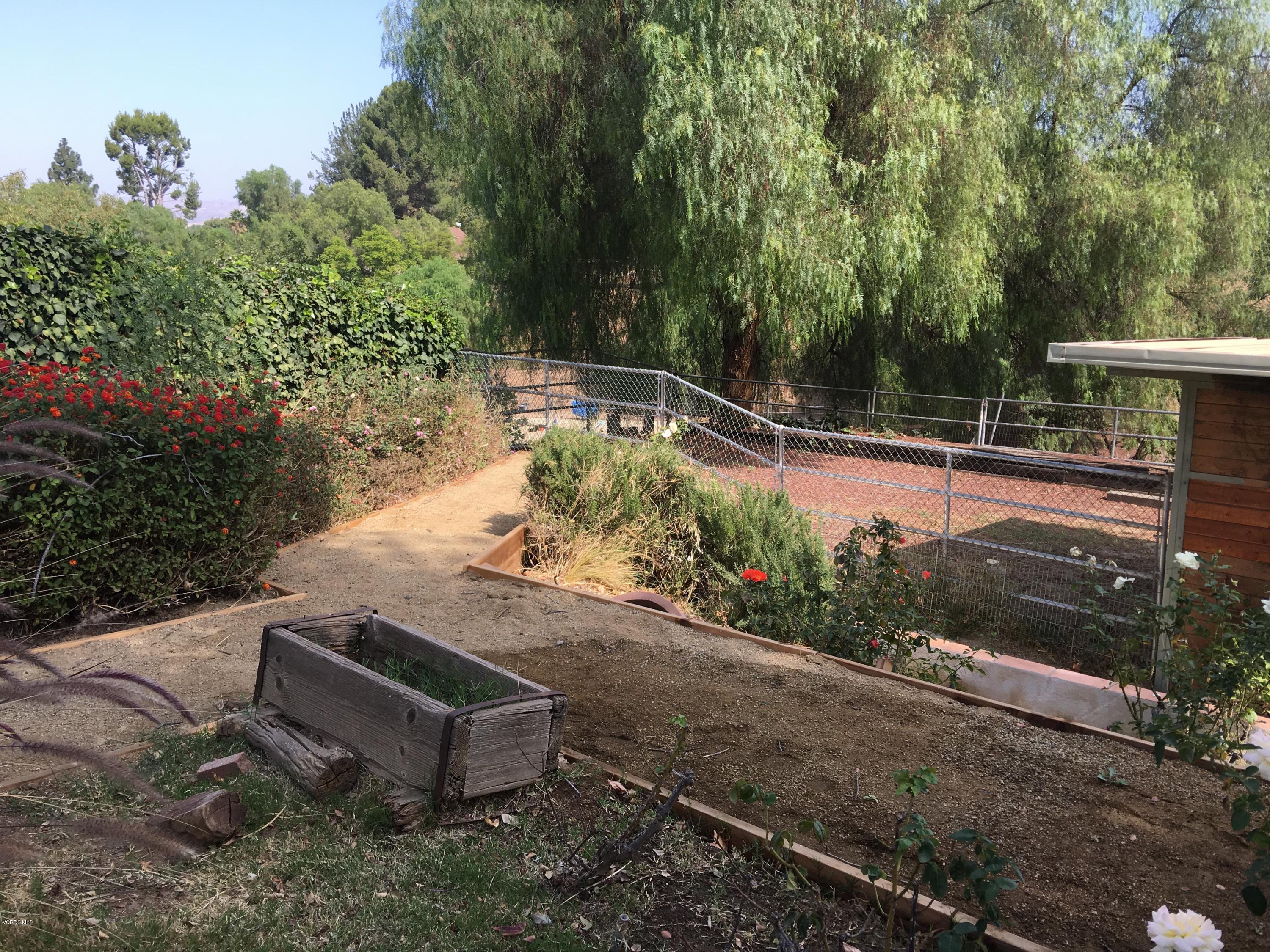 718 Tranquil Lane Simi Valley, CA 93065 - Photo 48 of 68 a garden view with a seating space