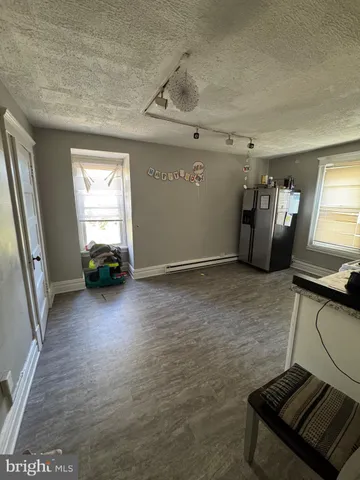 a workspace with furniture and wooden floor