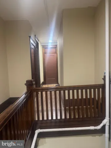 a view of a livingroom with furniture and a window