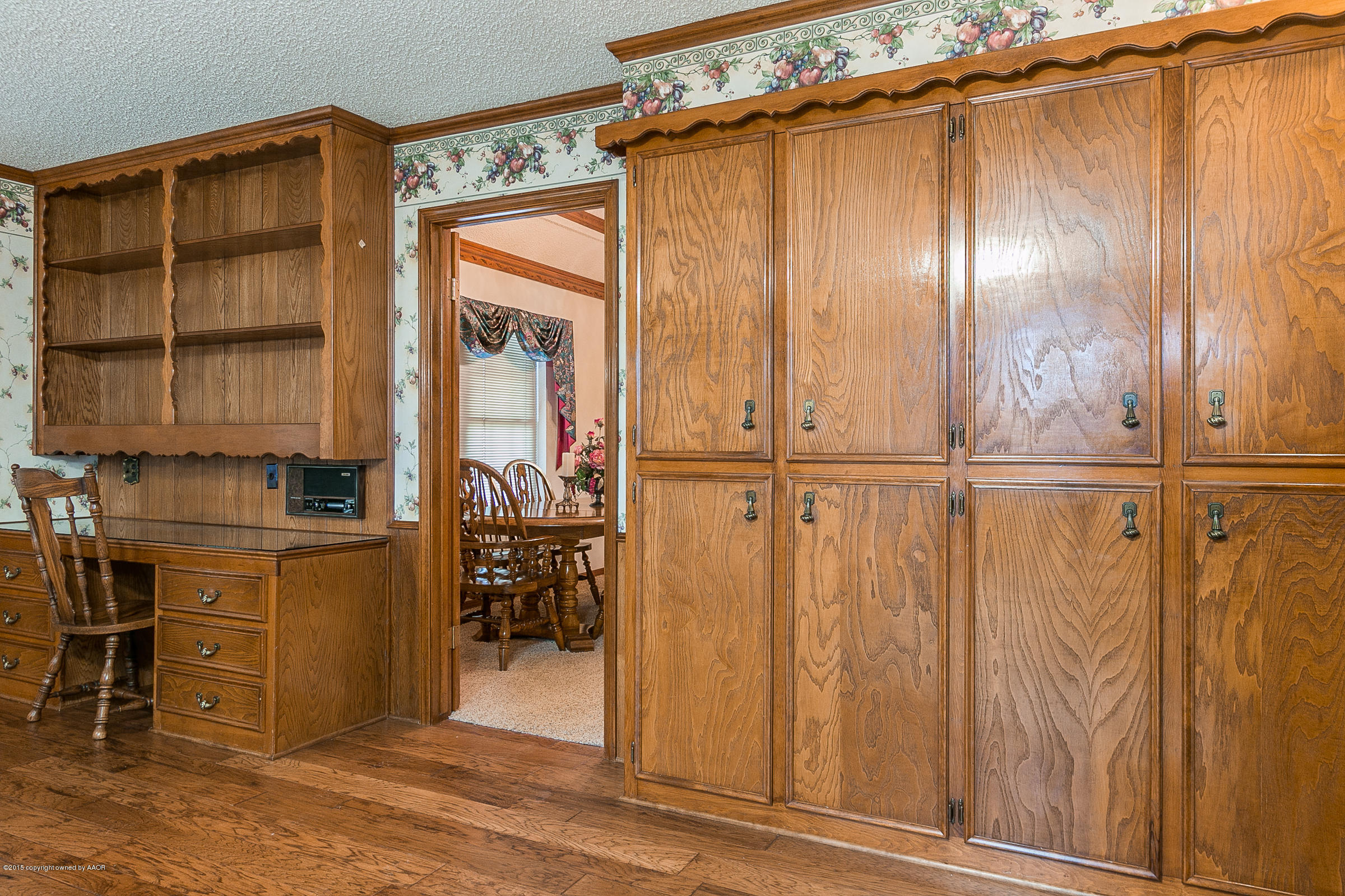 8117 Santa Fe Trail Amarillo, TX 79110 - Photo 12 of 27 an empty room with wooden floor and windows