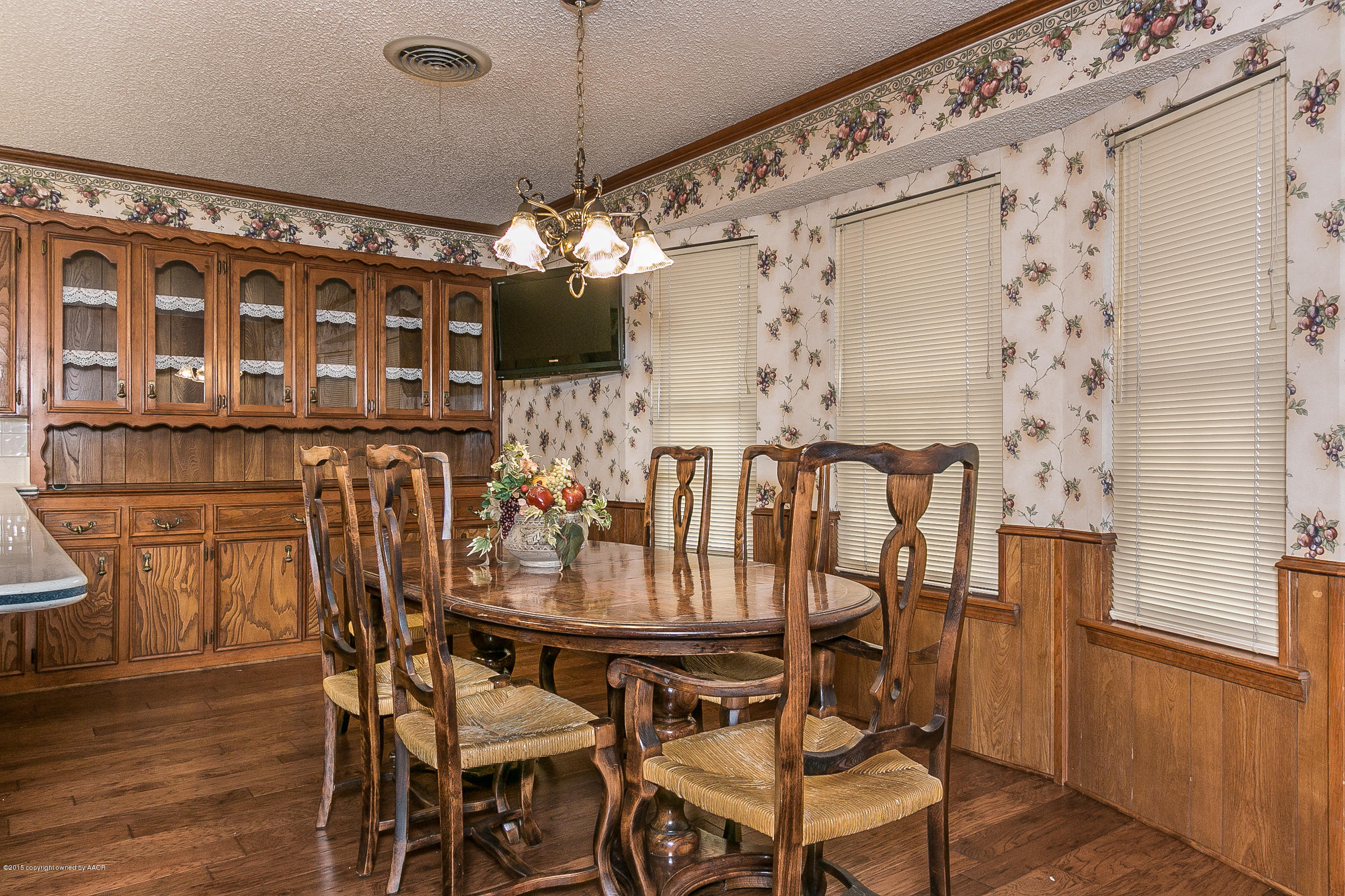 8117 Santa Fe Trail Amarillo, TX 79110 - Photo 13 of 27 a view of a dining room with furniture window and wooden floor