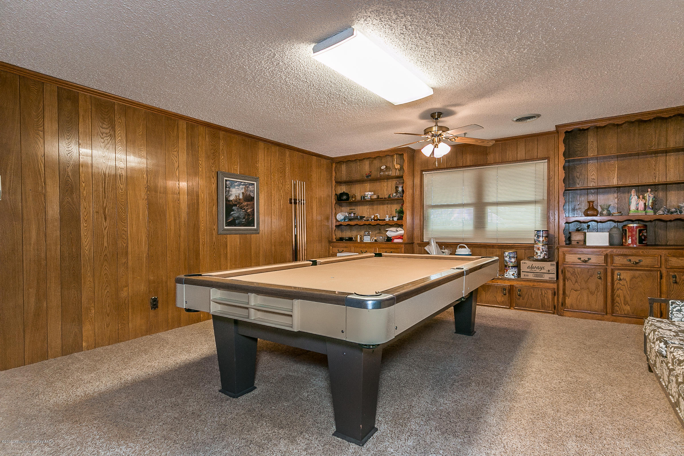 8117 Santa Fe Trail Amarillo, TX 79110 - Photo 21 of 27 a room with pool table and a chandelier