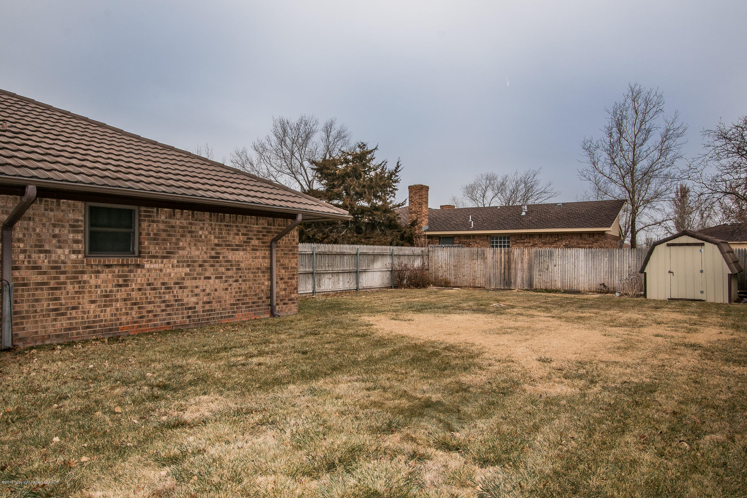 8117 Santa Fe Trail Amarillo, TX 79110 - Photo 25 of 27 a backyard of a house with lots of green space