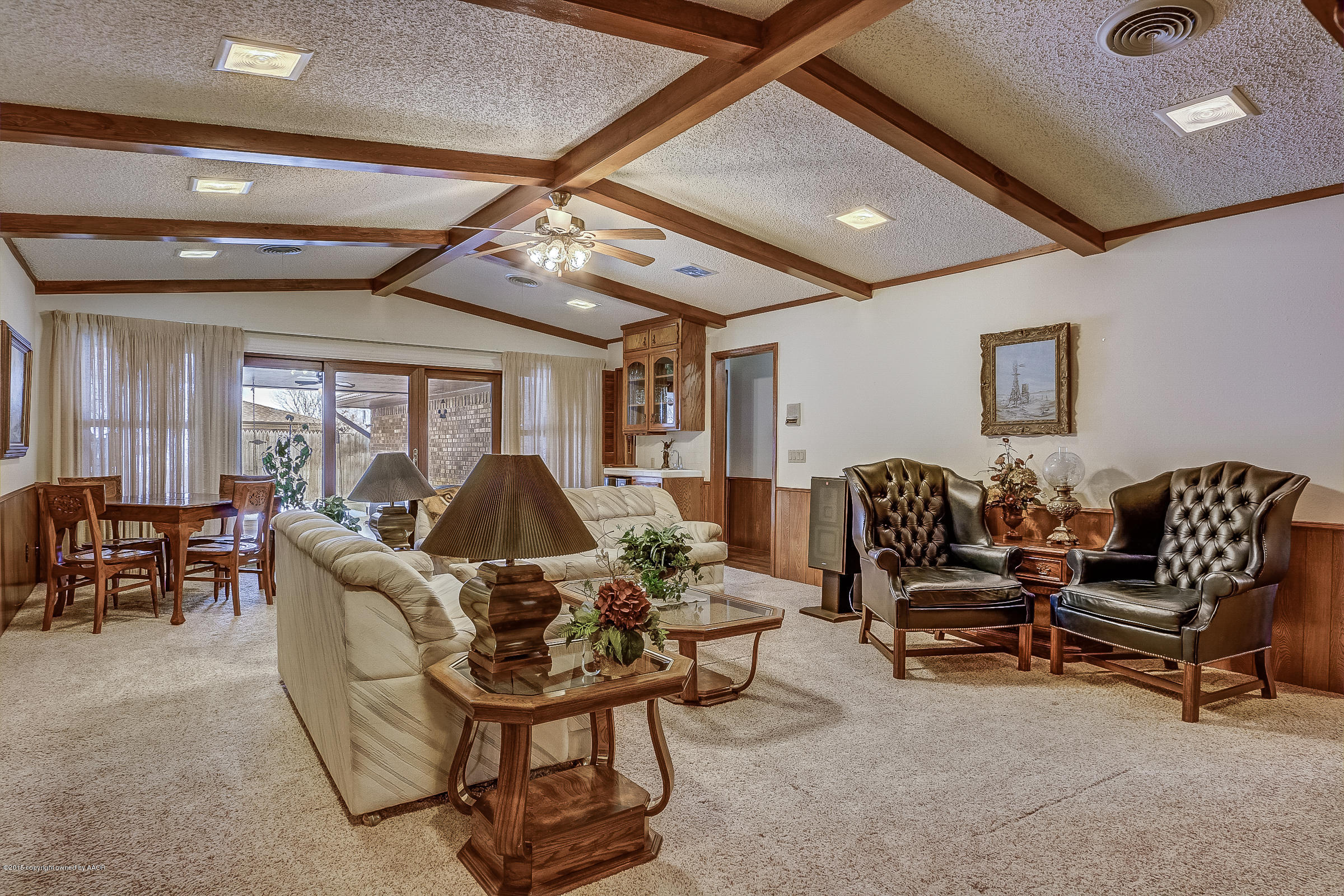 8117 Santa Fe Trail Amarillo, TX 79110 - Photo 5 of 27 a living room with furniture and a chandelier